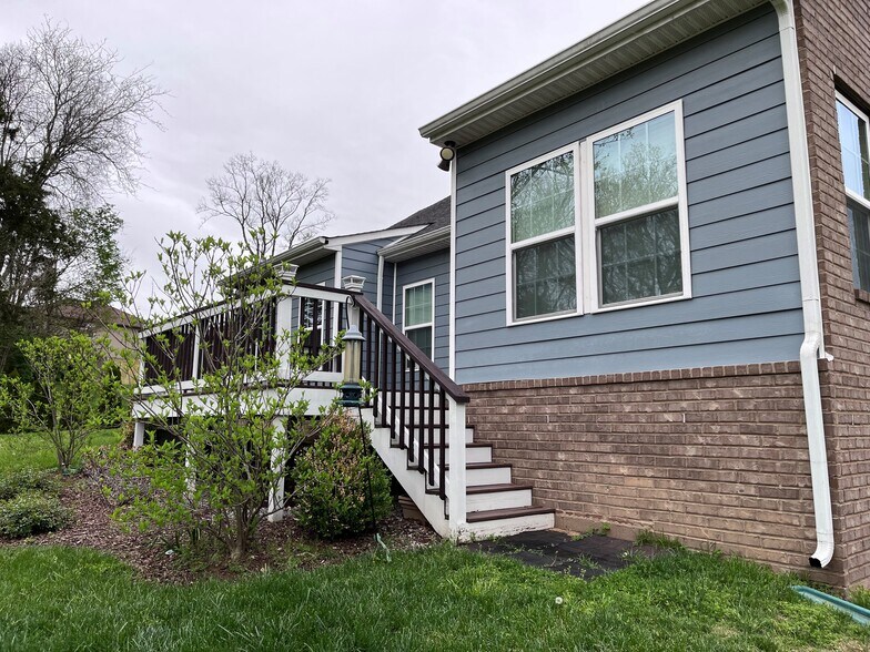 Back of the house, with the back deck - 7736 Tranquil Trl