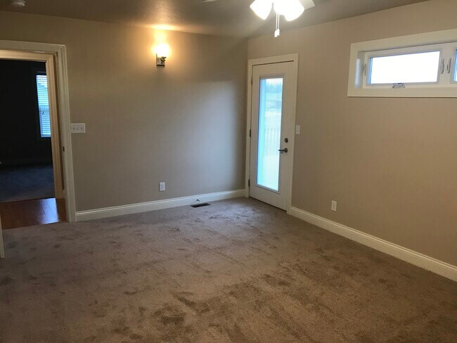 Large Master bedroom with private deck, ceiling fan and carpet. - 113 Scenic Dr