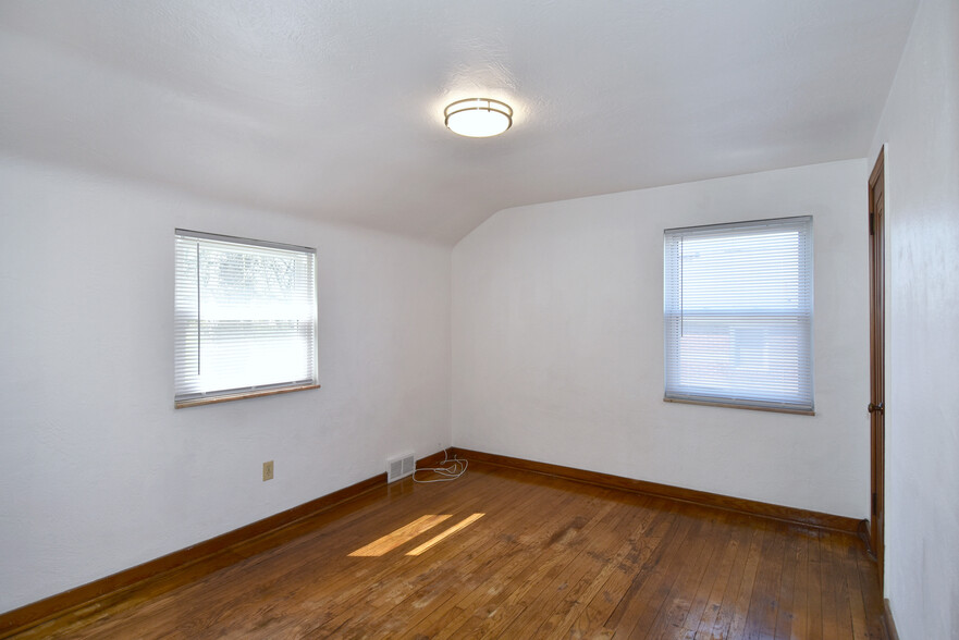 Spacious Bedroom #2 with refinished original hardwood flooring - 31 Marylea Ave