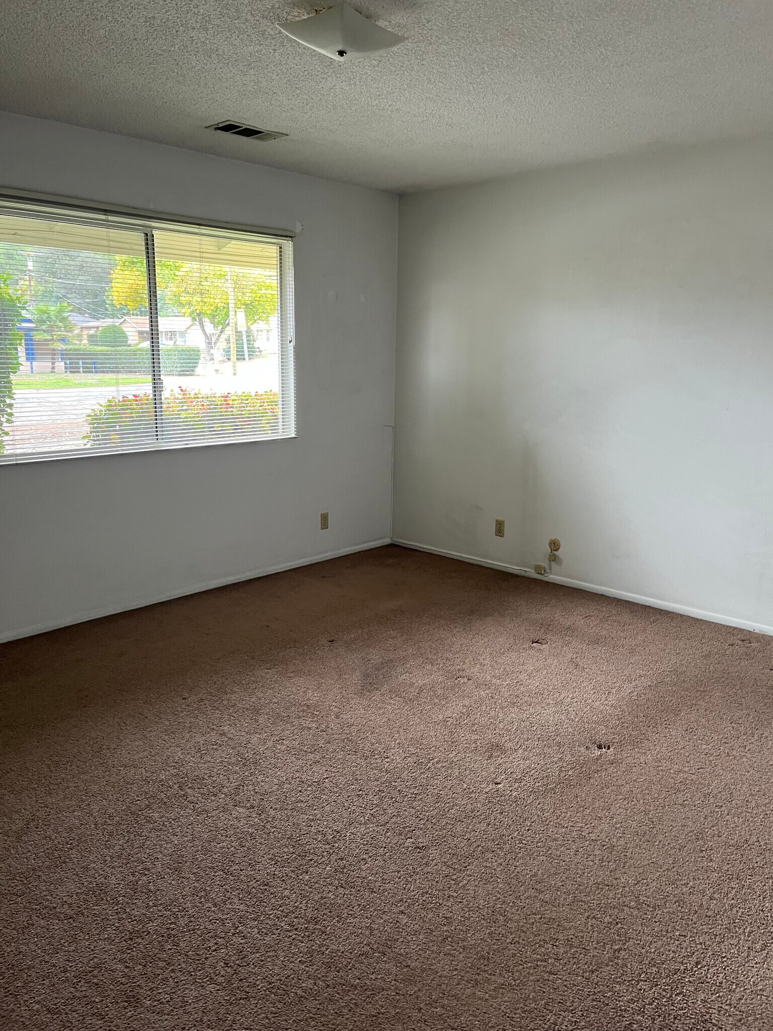 Front Bedroom. New neutral carpet being installed - 513 28th St
