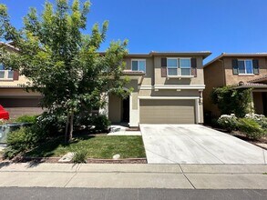 Building Photo - Stunning 4 Bedroom, 3 Bath Gated Community W/ Solar