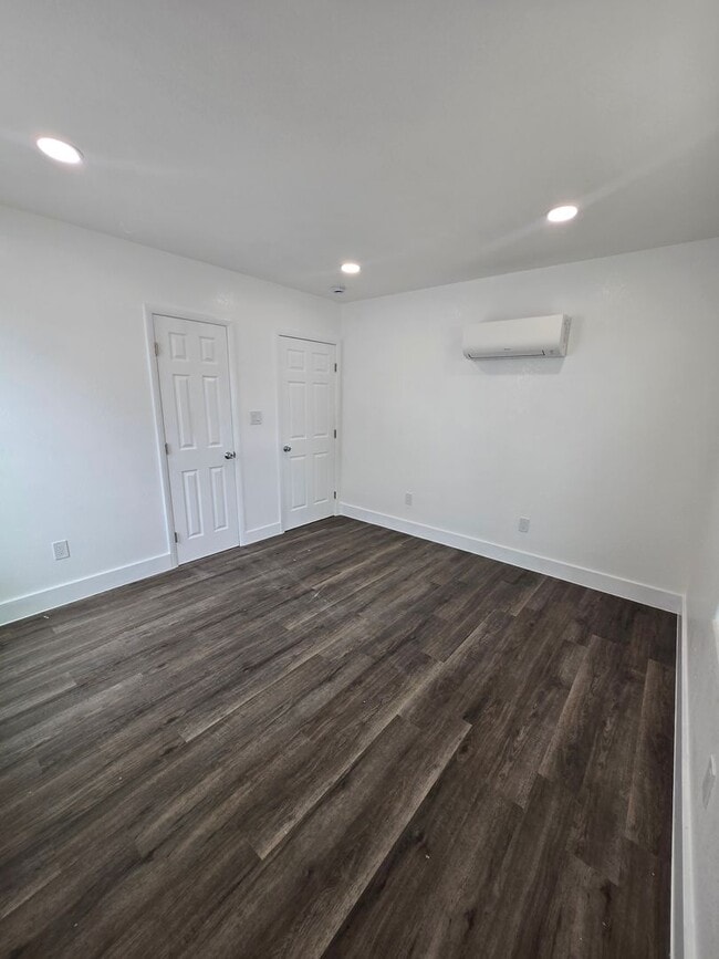 Building Photo - New paint and flooring throughout.
