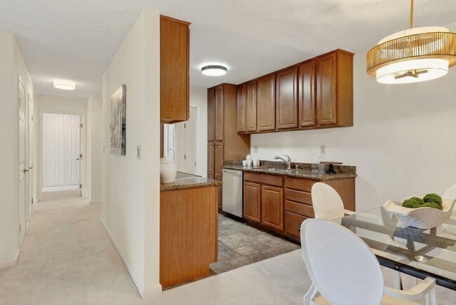 Building Photo - Modern 2-Bedroom Condo with Pool and Koi Pond Views