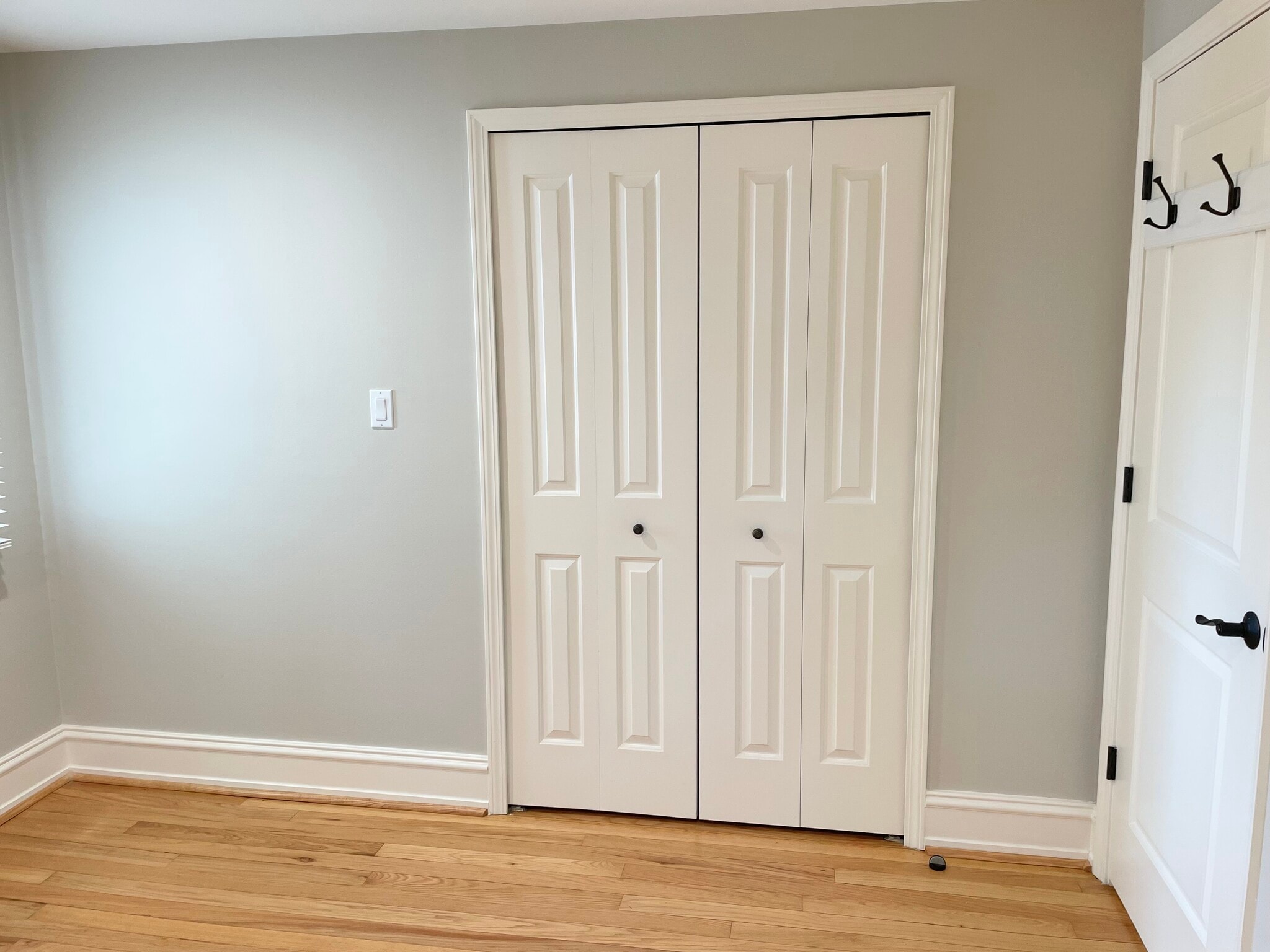 Second bedroom entrance with hooks on door and closet - 1620 Graefield Rd