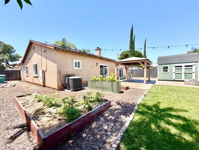 Building Photo - Beautifully Renovated 4 Bedroom Home with INCLUDED Solar, Large Backyard & Gazebo