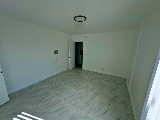 Empty bedroom - Churchill Apartments