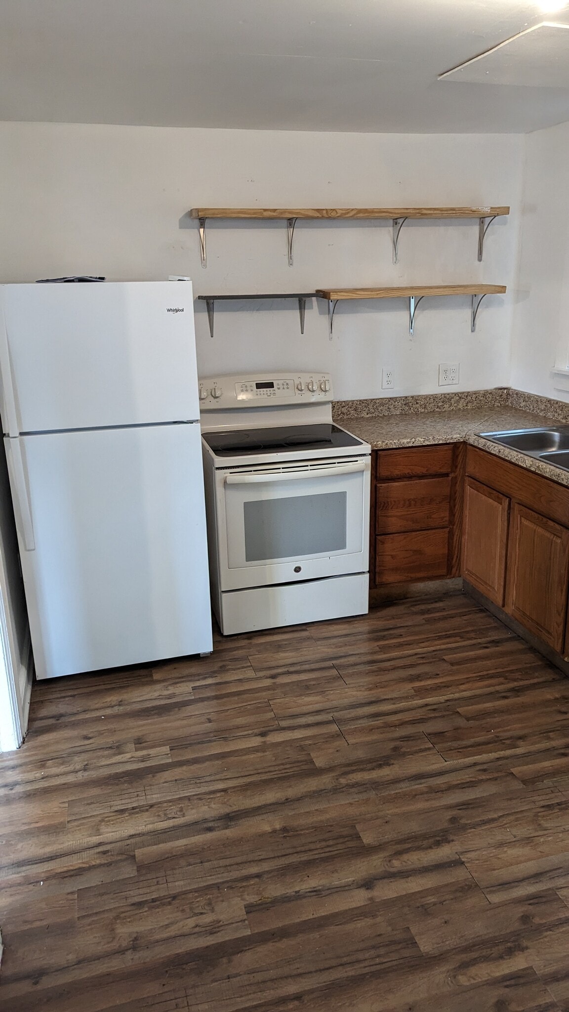 Kitchen comes with sink, counter, cabinets, floating shelves, range oven and brand new refrigerator - 1208 Preston St