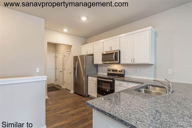 Building Photo - "Charming 2-Bedroom Home in Exclusive 36 W...