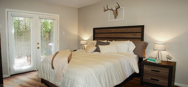 First floor bedroom is large enough to comfortably hold this king size bed - 6724 Eastridge Dr