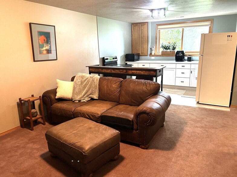 Open space living room into kitchen area - 205 S West Ave