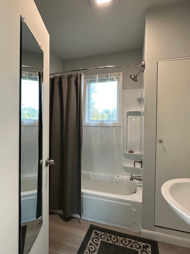 Bathroom with new tub surround. - 16 Crescent Beach Dr