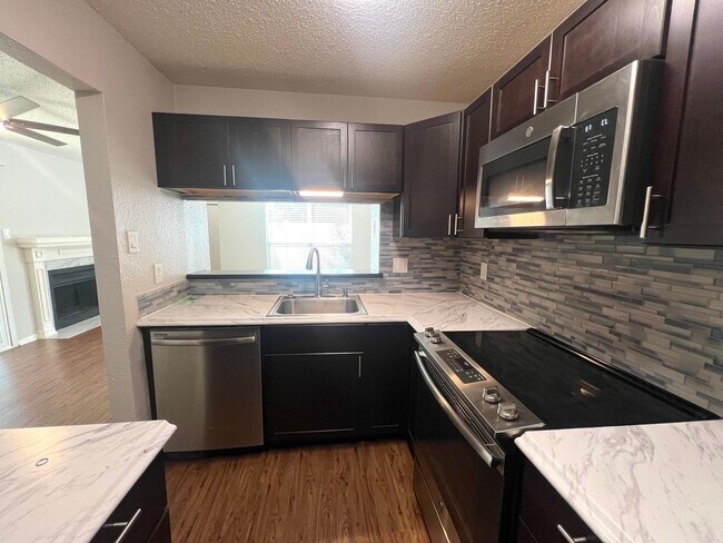 Building Photo - Two Stories 2 Bedroom 1.5 Bath Condo Home for rent near Domain,  Ground Floor with Balcony, Gated...