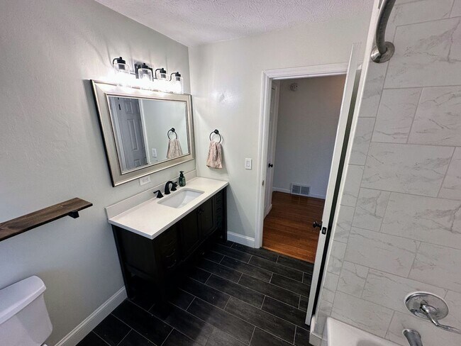 Building Photo - AVAILABLE NOW! Spacious 4 BR, 2 Bath House! Wood Floors, Attached Garage, W/D Included
