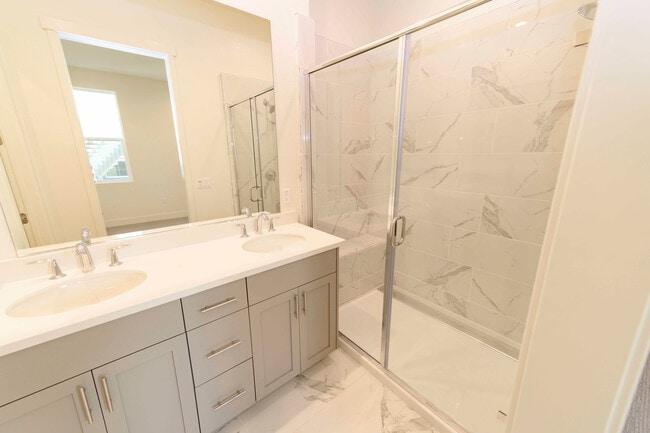 Building Photo - Experience contemporary urban living at its finest. Private Garage & Dual Suites!