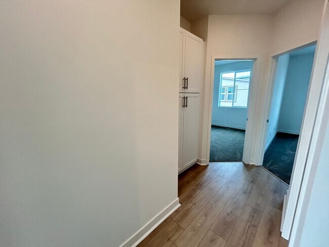 Building Photo - Gorgeous, 3 level townhome, featuring 2 car garage central Air, and in Unit laundry.