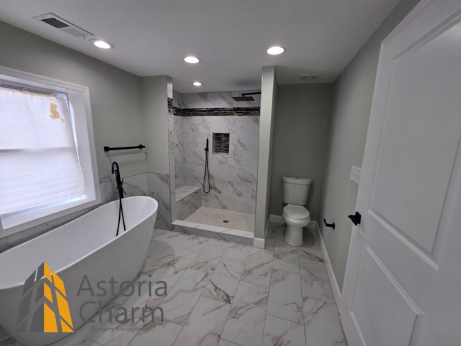 Building Photo - 4 Bedroom Rowhome with Loft Style Primary Suite and Finished Basement