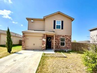 Building Photo - Home with fenced in backyard and covered b...