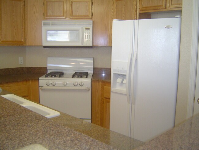 Building Photo - Move-In Ready Condo with Private Balcony & Modern Upgrades