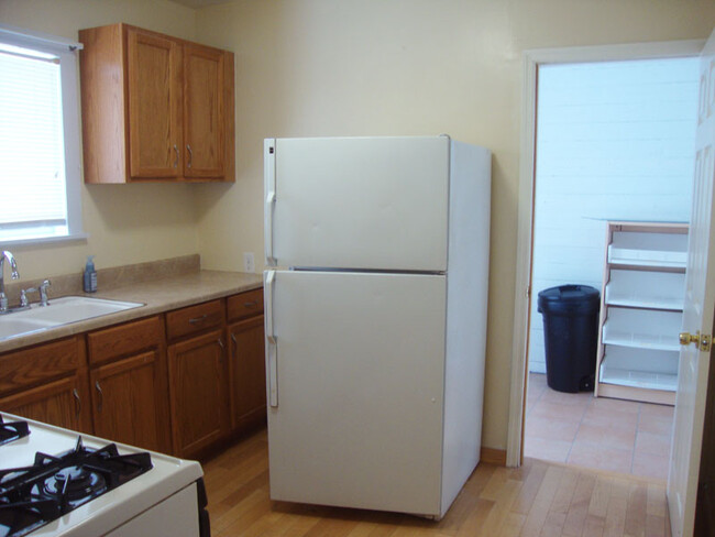 Kitchen from living room door. Muc room entry on right. - 239 W Venango St