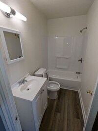 Building Photo - Ground Level 2 Bedroom, 2 Bath apartment. New flooring and paint. Tenant pays electric and natura...