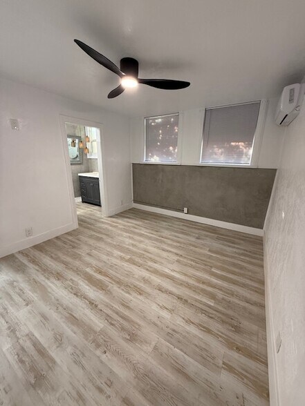 Bedroom fits a queen-sized bed and has lots of light. - 24606 University Ave