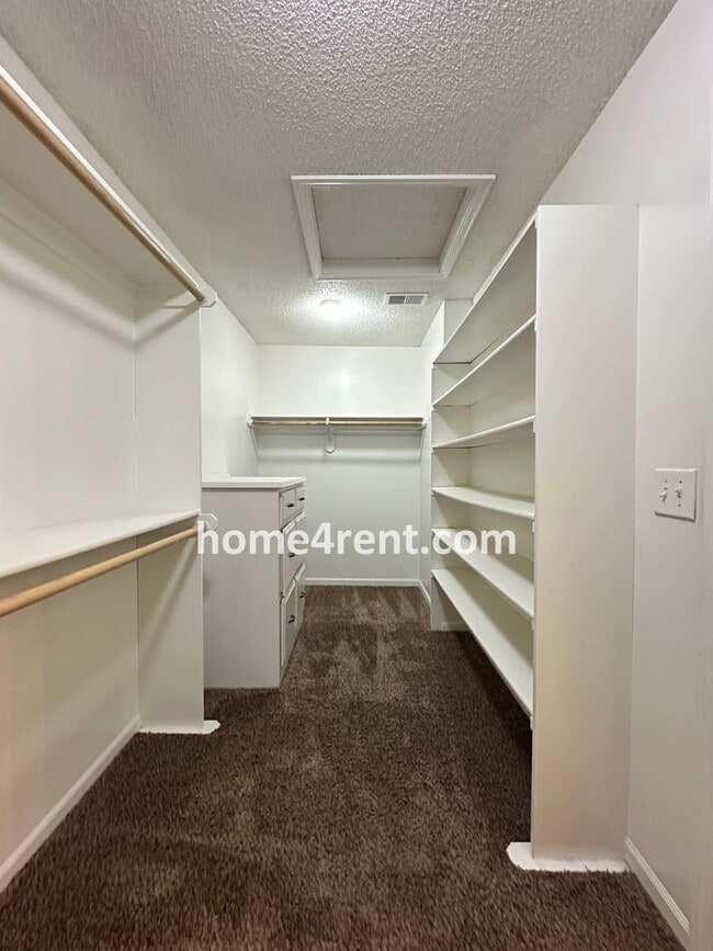 Building Photo - Updated Kitchen, Large Two Tiered Deck, Finished Basement in Blue Valley Schools!