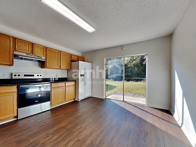 Building Photo - 6686 Gentle Oaks Dr E