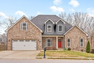 Building Photo - Pet Friendly Three Bedroom with Bonus!