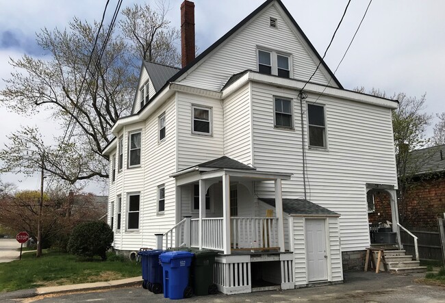 back view of building with parking for 2 cars - 112 Harriet St