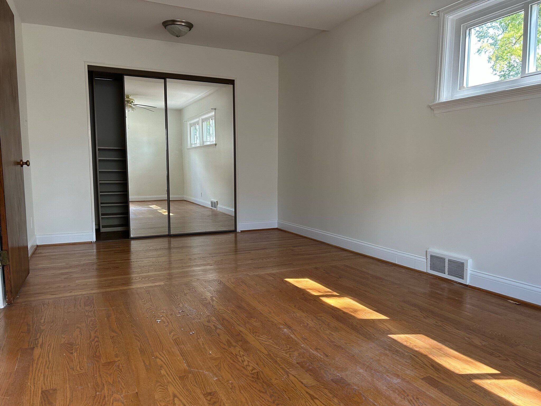 primary bedroom - Two rooms were combined to create this room with a large closet - 117 Morningside Dr