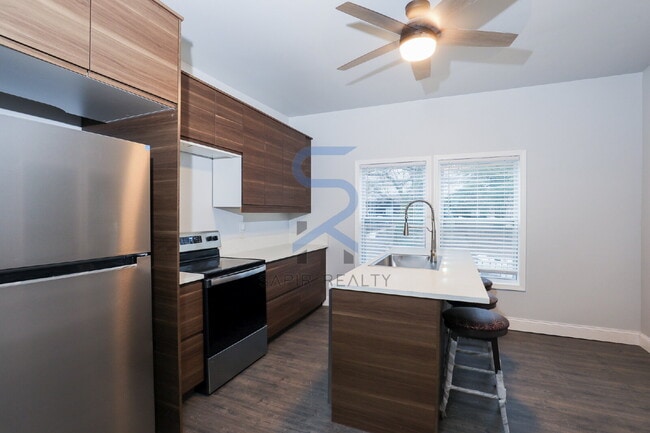 Building Photo - Move in before February 28th and choose your reward: a $250 Amazon Gift Card or a 55" Smart TV!