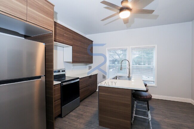 Building Photo - Move in before January 15th and choose your reward: a $250 Amazon Gift Card or a 55" Smart TV!