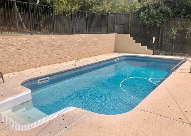 Building Photo - Hilltop Living with a Pool, Loft & Spacious Backyard