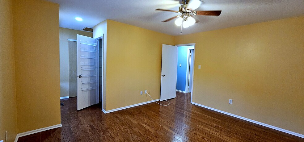 Spacious Primary Bedroom | A genuinely large primary suite: hardwood floors, lighted ceiling fan - 43 Tynemouth Ct