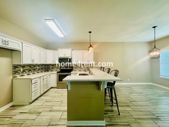 Building Photo - Ranch Style Home w/ Updated Kitchen, including SS Appliances and Granite Counters Plus a Large Un...