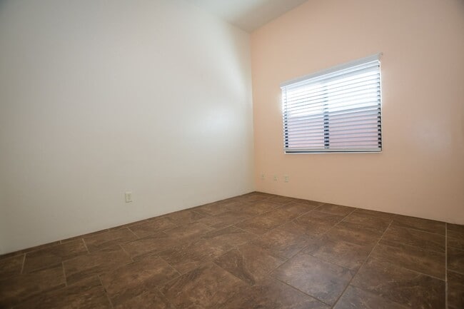 Building Photo - Gorgeous 3 Bedroom 2 Bathroom Home with Tile Throughout! Central A/C, 2 Car Garage!