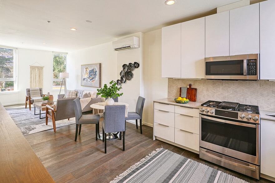 Up one stair to the main floor with a living/kitchen great room. - 818 N 47th St