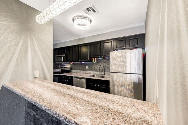 Building Photo - GATED COMMUNITY CONDO WITH BRAND NEW UPGRA...