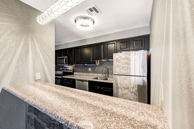 Building Photo - GATED COMMUNITY CONDO WITH BRAND NEW UPGRADES THROUGHOUT