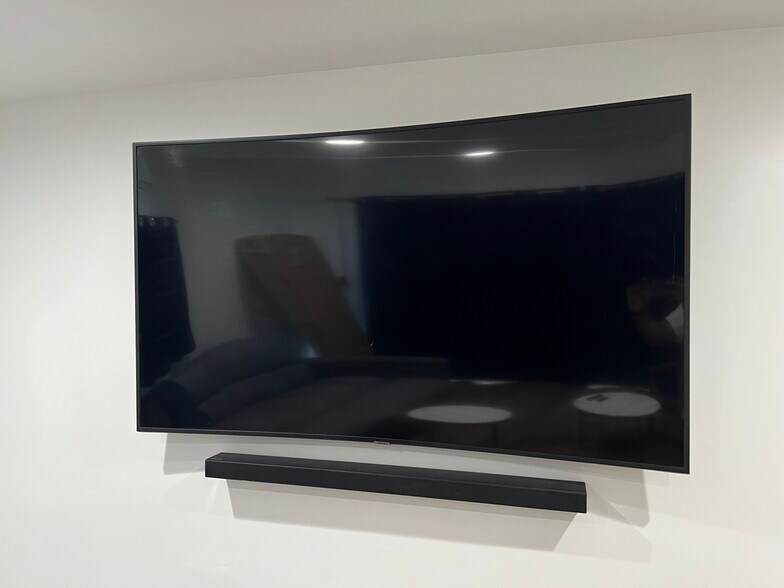 70” Curved TV w/ soundbar - 1849 W 49th St