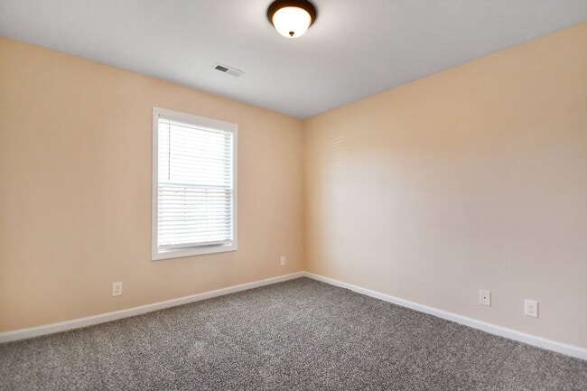Building Photo - Pet Friendly Three Bedroom with Bonus!
