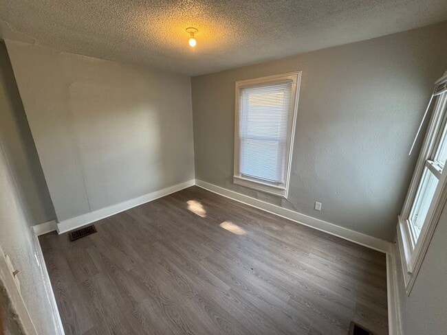 Building Photo - Two-bedroom house that includes a large garage.
