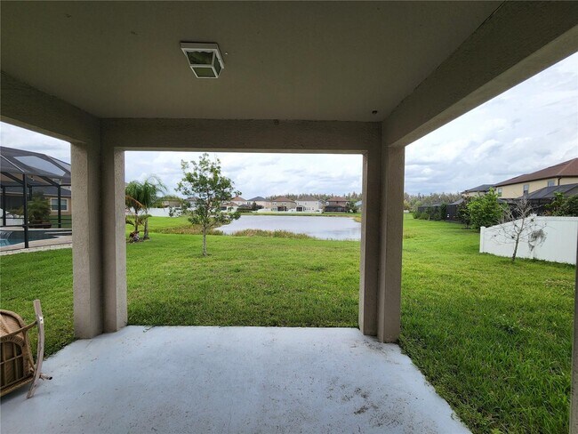 Building Photo - "Spacious 5-Bed Retreat with Elegant Hardwood & Granite Finishes in Tampa – 3 Full Baths & 3264 S...