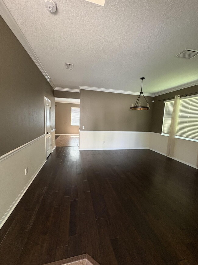 Building Photo - Spacious 5-Bedroom Pool Home with Putting ...