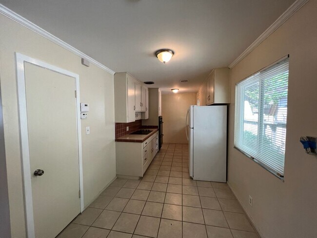 Building Photo - Two-bedroom single story unit with a carport!