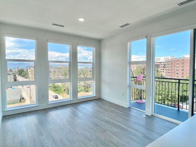 Building Photo - Luxury Top-Floor Condo with Stunning Mountain & City Views