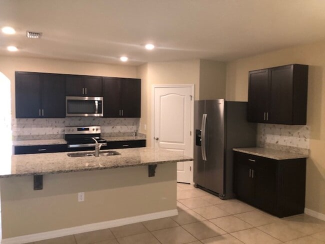 Building Photo - 4/2 with great FENCED in yard and upgraded!