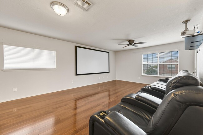 Living Room (Upstairs) *furniture, movie projector, and screen included* - 5709 Valley Stream Way