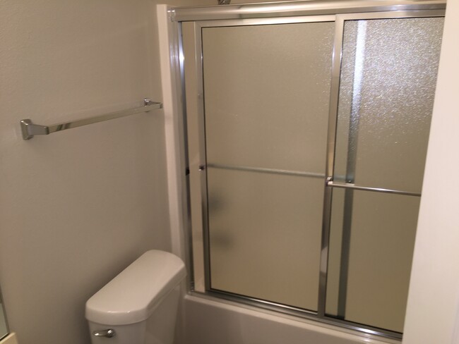 Shower doors in both bathrooms - 15026 Camden Ave