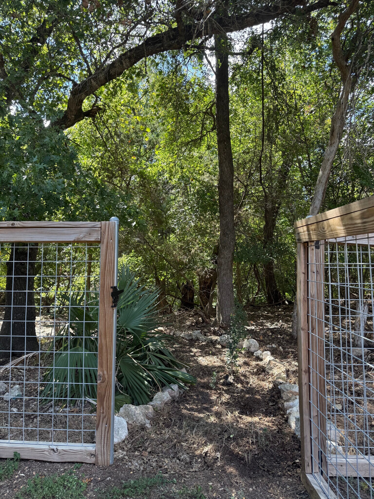Backyard gate to the Greenbelt and creek - 15327 English River Loop